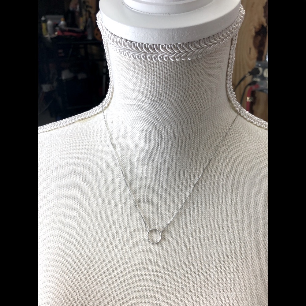 Silver Necklace with a Delicate Circle at the end.